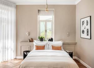 Letto o letti in una camera di Noel Suites