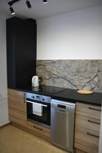 Kuchyňa alebo kuchynka v ubytovaní Apartment Jerzmanowskiego Krakow