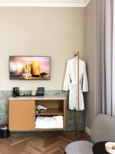 TV o dispositivi per l'intrattenimento presso Noel Suites
