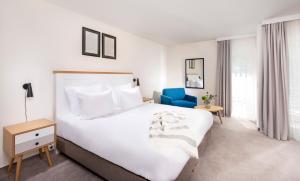 Precise Resort Marina Wolfsbruch - Familienapartments客房内的一张或多张床位