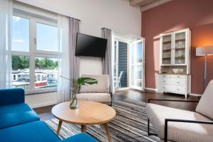Precise Resort Marina Wolfsbruch - Familienapartments पर बैठने की जगह