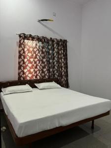 Hotel Raghunath Palace客房内的一张或多张床位