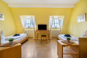 TV a/nebo společenská místnost v ubytování Gästezimmer am Kleinmarkt
