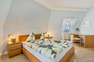 Postel nebo postele na pokoji v ubytování Gästezimmer am Kleinmarkt