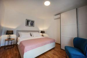 Postel nebo postele na pokoji v ubytování Apartman Oleandar