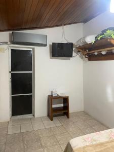 TV a/nebo společenská místnost v ubytování Pousada e Camping Lumiar