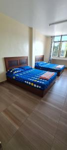 Postel nebo postele na pokoji v ubytování KB Guesthouse