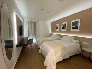 Cama o camas de una habitación en La Hospedería - El Provencio