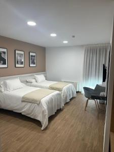 Cama o camas de una habitación en La Hospedería - El Provencio