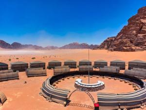 a building in the middle of the desert at Wadi Rum Majestic Camp in Wadi Rum