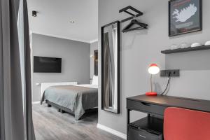 Postel nebo postele na pokoji v ubytování Hotel Aska