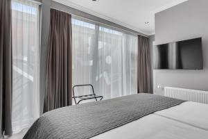 Postel nebo postele na pokoji v ubytování Hotel Aska