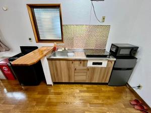 Kuchyň nebo kuchyňský kout v ubytování Apartment Hotel 下野