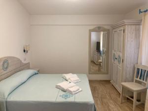 A bed or beds in a room at Hotel Villa Campana