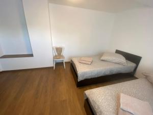 Postel nebo postele na pokoji v ubytování Gästehaus EMELI