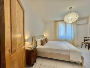 a bedroom with a large bed and a window at Casa Spartea Cilento coast in Marina di Camerota