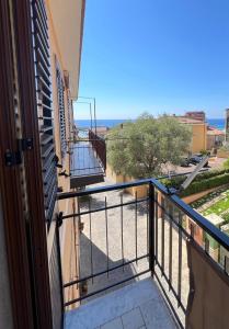 a balcony with a view of the ocean at Casa Spartea Cilento coast in Marina di Camerota
