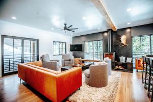 a living room with a couch and a fireplace at Stunning New Build! Xanadu - Private Luxury Home at Solitude Mountain Resort in Solitude