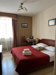 Postel nebo postele na pokoji v ubytování Hotel Lavilia