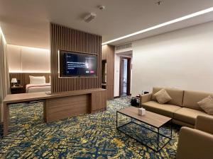 TV a/nebo společenská místnost v ubytování Sur Grand Hotel