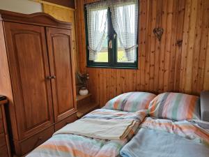 Postel nebo postele na pokoji v ubytování Kleine Jagdhütte