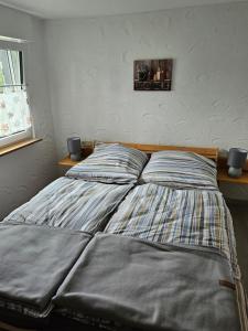 Postel nebo postele na pokoji v ubytování Kleine Jagdhütte