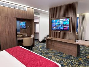 TV a/nebo společenská místnost v ubytování Sur Grand Hotel