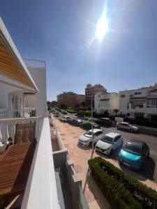 a row of cars parked in a parking lot at Honduras 11alto in Roquetas de Mar