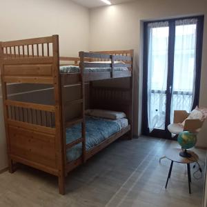 a room with two bunk beds and a table at Casa Martina in Canale