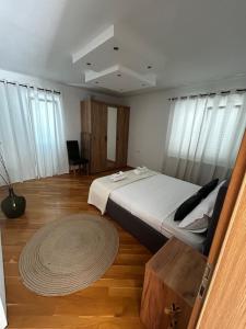 Postel nebo postele na pokoji v ubytování Apartman Marija