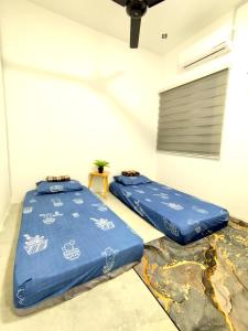 Postel nebo postele na pokoji v ubytování Soffea D'Homestay Pagoh - WiFi , NetFlix