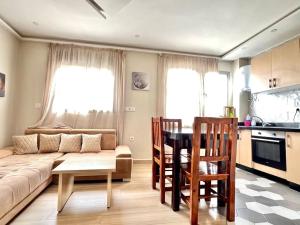 a living room with a couch and a table at Appartement HAY SALAM Agadir in Agadir +6 photos