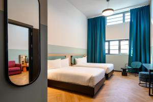 Ein Bett oder Betten in einem Zimmer der Unterkunft CX Milan Bicocca
