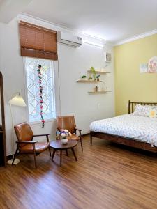 Ein Bett oder Betten in einem Zimmer der Unterkunft Mô Tê Homestay 2 gần Chợ Đông Ba, Cung Đình Hoàng Thành Huế