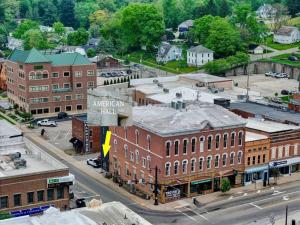 an aerial view of a town with buildings and a street at Clay St Suite in Millersburg
