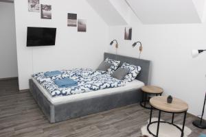 Postel nebo postele na pokoji v ubytování Apartmán Pod Hrází Chráštany