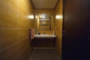 a bathroom with a sink and a mirror at Vue Mer Tanger city hitlon Garden Appartement Parking Gratuit in Tangier +27 photos