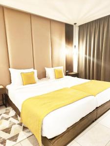 Postel nebo postele na pokoji v ubytování Samarons Hotels