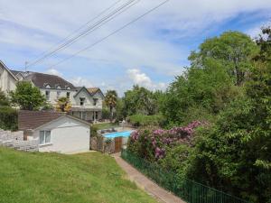 a house with a swimming pool in a yard at 27 Fernhill Heights in Bridport