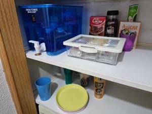 a shelf with a tray and other items on it at Habitación Familiar in Madrid +11 photos