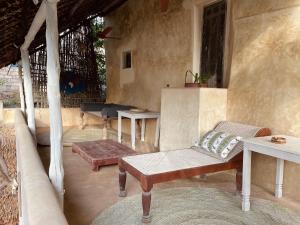 a living room with a couch and a table at Umma House in Lamu