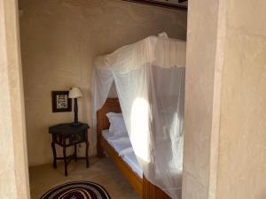 Ένα ή περισσότερα κρεβάτια σε δωμάτιο στο Umma House