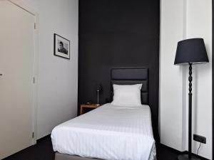 Voodi või voodid majutusasutuse Hotel St James toas