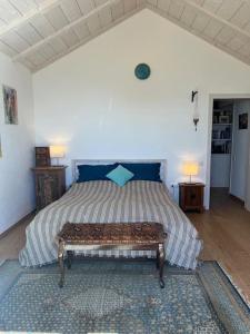 En eller flere senge i et værelse på Ferienhaus Finca Sonrisa