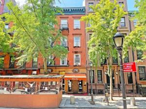 a street light and trees in front of a building at Central Location Studio Walk to Times Square in New York