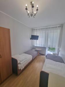 Postel nebo postele na pokoji v ubytování Pokoje Basia