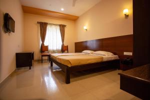 Postel nebo postele na pokoji v ubytování Philomena Hotel & Apartment + 17 fotografií