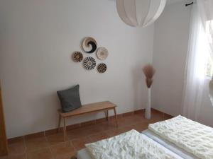 a white room with two beds and a table at Casa los Limones Torrox in Torrox +15 photos