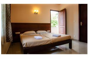 Postel nebo postele na pokoji v ubytování Philomena Hotel & Apartment