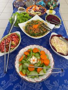 a blue table with plates of food on it at Hot Star Thermas Hotel in Caldas Novas +36 photos